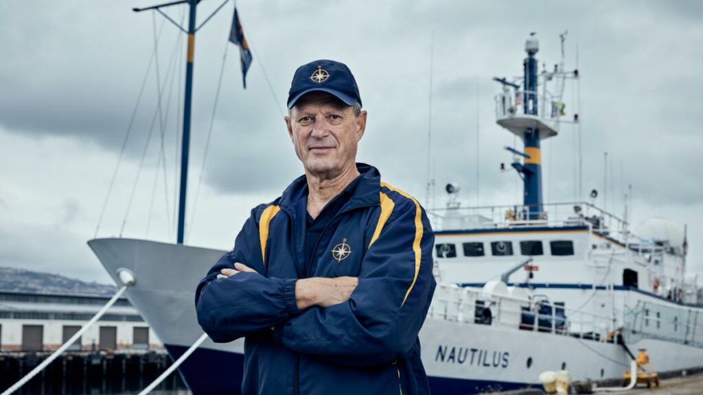 Robert Ballard of Ocean Exploration Trust standing near the bow of the exploration vessel, Nautilus